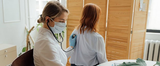 Doctor treating patient